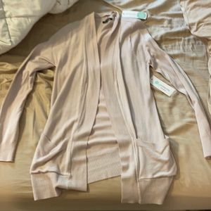 Light pink cardigan.